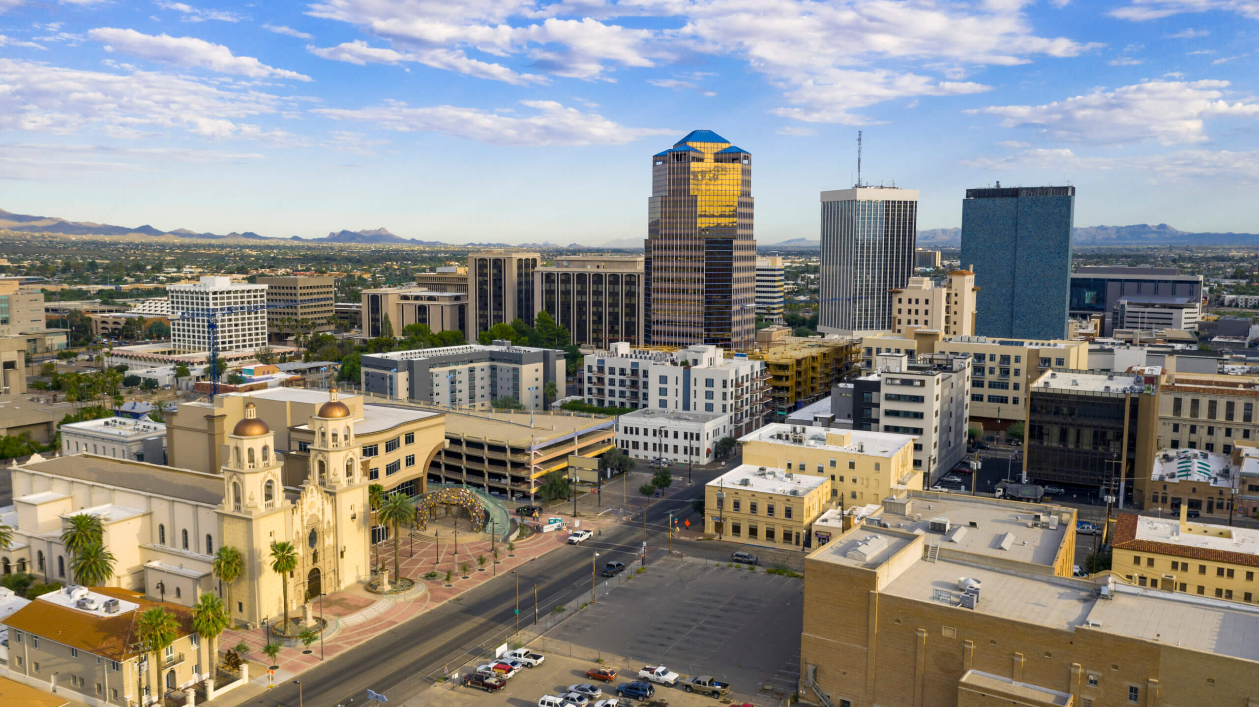 An aerial view of Tucson during the day with a blue sky